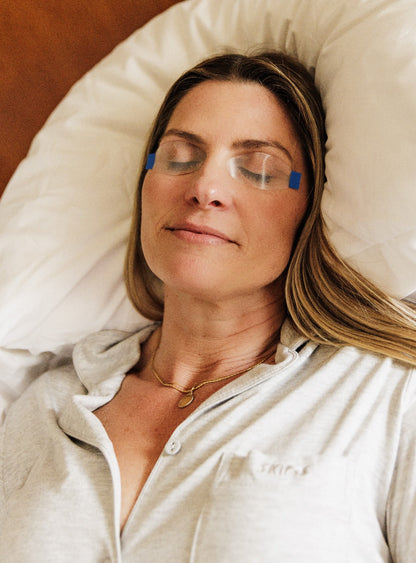 Woman waking up with refreshed eyes after using SleepTite SleepRite overnight lid seals